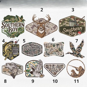 May include: A selection of eleven hunting and fishing-themed patches. Designs include fish, deer, ducks, and the text "Southern Boy", "It's Hunting Season", and "Local Boy". The patches feature camouflage patterns and outdoor imagery.