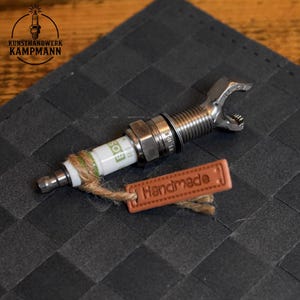 apribottiglie fatto a mano ricavato da una candela