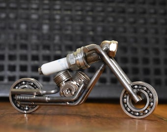 Handmade spark plug for motorcycle V-engine chopper, inspired by Harley Davidson.