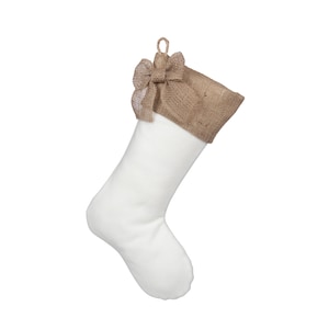 May include: White Christmas stocking with a burlap cuff and a burlap bow.
