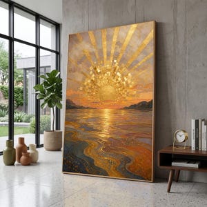 May include: A large rectangular wall art piece featuring a textured golden sunburst rising over a calm body of water. The painting uses shades of gold, orange, and deep blue to depict a sunset landscape with reflective light patterns on the surface.