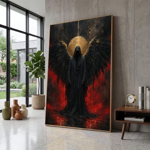 May include: A large rectangular wall art print featuring a hooded figure with expansive black wings standing against a vibrant red background. A textured gold circular halo sits behind the figure's head, contrasting with the dark, flowing robes.