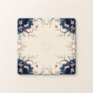May include: A square mouse pad featuring a cream-colored center with a circular floral motif. The border displays dark blue watercolor-style clouds, thin black branches, and delicate pink cherry blossoms with green bamboo leaves in the corners.