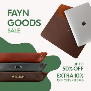 May include: The image showcases a brown leather laptop sleeve with a silver laptop. Below are three personalized leather trays with the names "KEVIN", "JOHN", and "WILLIAM". The text "FAYN GOODS SALE" is displayed, along with sale information.