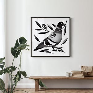 May include: Framed monochrome art print of a pigeon with an olive branch. The artwork has a minimalist design with a grayscale colour palette. The pigeon is depicted with detailed shading, and the olive branch adds a touch of nature to the image.