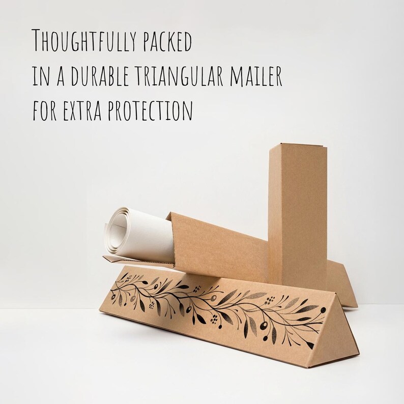 May include: A rolled canvas print inside a brown triangular mailer box. The box has a decorative black and white floral design. Text on the image reads: "THOUGHTFULLY PACKED IN A DURABLE TRIANGULAR MAILER FOR EXTRA PROTECTION."
