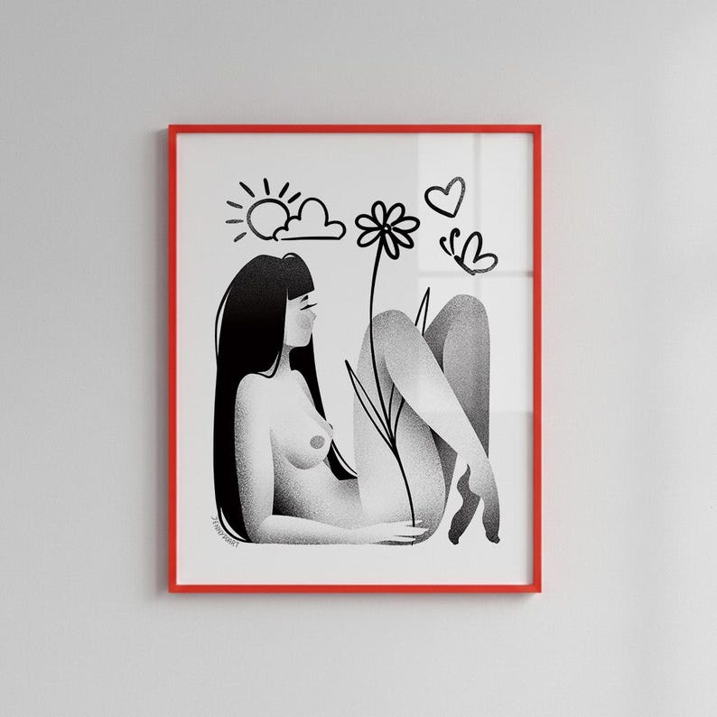 May include: Black and white art print in a red frame. The illustration depicts a person reclining with long black hair, a flower, sun, clouds, a heart, and a butterfly. The artwork has a minimalist style.