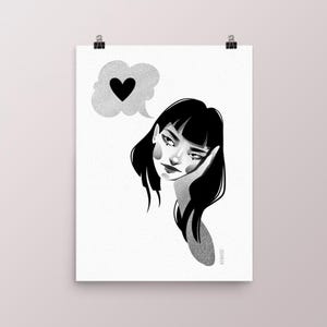 May include: Black and white illustration of a woman with black hair, resting her head on her hand. A thought bubble with a black heart floats above her head. The artwork is clipped to a white background.