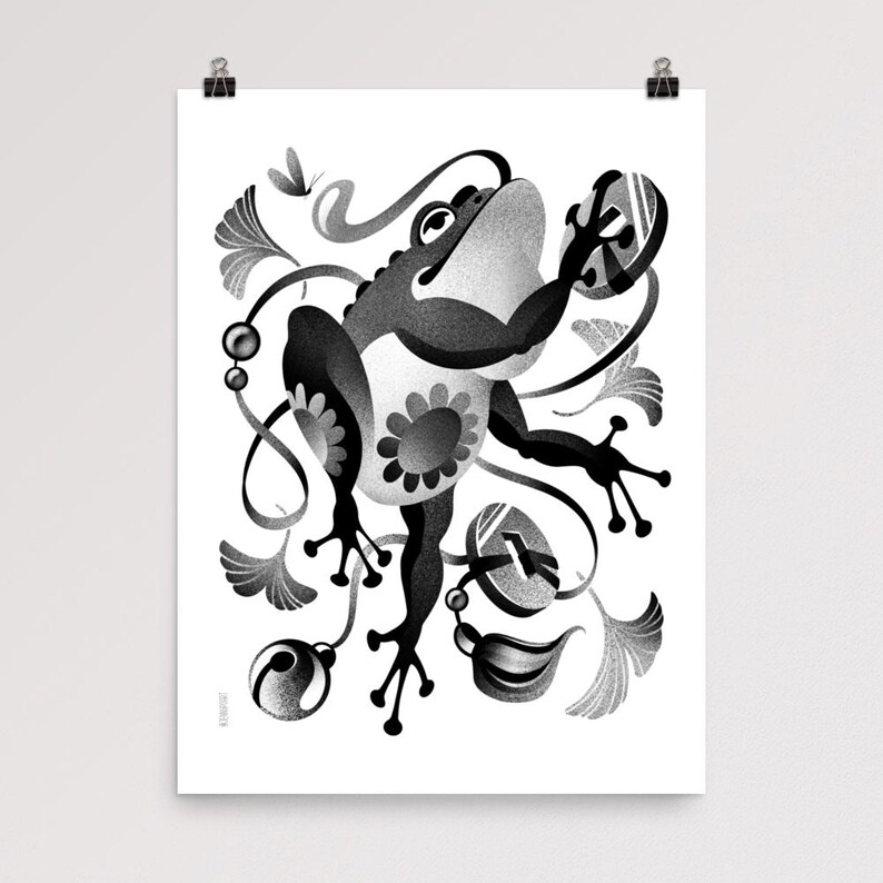 May include: Monochrome art print depicting a stylized frog with a floral pattern on its belly. The frog is set amongst decorative leaves, swirls, and a butterfly. The artwork is printed on white paper.