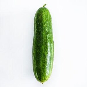 May include: A single fresh cucumber with a vibrant green, bumpy skin and a small stem at the top. The vegetable has a cylindrical shape with slightly tapered ends, showcasing a natural, glossy texture and a deep green colour throughout its surface.