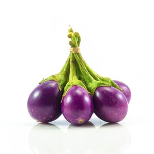 May include: A cluster of four small, round, deep purple aubergines with smooth, glossy skin. Each aubergine features a vibrant green calyx and stem, and they are bundled together at the top with a thin, light-coloured rubber band.