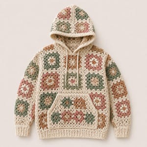 May include: A long-sleeve hooded sweatshirt constructed from crocheted granny squares in a palette of cream, sage green, dusty rose, and tan. The garment features a front kangaroo pocket, a drawstring hood, and ribbed cuffs and hem.