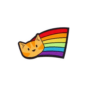 May include: An embroidered patch featuring an orange tabby cat head with dark orange stripes, black eyes, and a small nose. A vibrant rainbow trail extends from the right side of the cat head, consisting of red, orange, yellow, green, blue, and purple.
