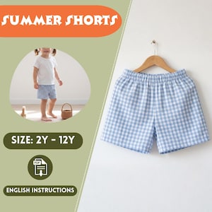 May include: A pair of blue and white gingham summer shorts hanging on a wooden hanger. The shorts are displayed against a white background. Text on the image reads "SUMMER SHORTS", "SIZE: 2Y - 12Y", and "ENGLISH INSTRUCTIONS".