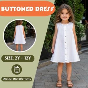 May include: A sleeveless white buttoned dress for girls. The dress has a round neckline and a row of buttons down the front. The image also includes a smaller image of the dress from the back and text that says "BUTTONED DRESS", "SIZE: 2Y - 12Y", and "ENGLISH INSTRUCTIONS".