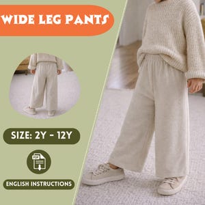 Puede incluir: Pantalones beige de pernera ancha, combinados con un suéter a juego y zapatillas deportivas. La imagen incluye el texto "WIDE LEG PANTS", "SIZE: 2Y - 12Y" y "ENGLISH INSTRUCTIONS". Ropa infantil.