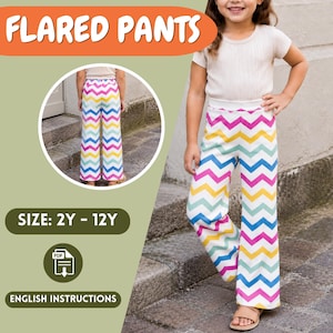 May include: Flared pants with a colorful chevron pattern in pink, yellow, blue, and white. The pants are shown on a young person. The text "FLARED PANTS" is at the top of the image. The size range is 2Y-12Y.