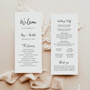 May include: Elegant wedding program cards with the words "Welcome" and "Wedding Party" in black script. The cards list the wedding details, including the names of the couple, the date, the ceremony order, and the wedding party members. The background is a neutral beige.