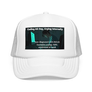 May include: White trucker hat with a curved brim and mesh back. The front panel features a graphic of a person at a computer with the text "Coding All Day, Crying Internally." Additional text reads "Now diagnosed with R45.83 Excessive crying, child, adolescent or adult."