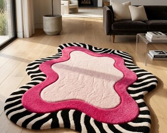 Abstrakter, unregelmäßiger Teppich, handgetufteter, gewellter Teppich, auffälliges Dekor in kräftigem Pink, Weiß und Schwarz