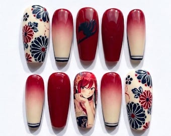 May include: A set of ten press-on nails featuring a glossy finish. The designs include a cream base with dark blue and red floral patterns, solid deep red nails, a red nail with a black emblem, and a nail featuring an anime character illustration.
