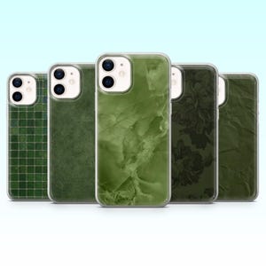 May include: Five green phone cases with various designs. The cases feature a mosaic tile pattern, a textured leather effect, a marble design, a floral print, and a crumpled paper texture. Each case has a clear border and a camera cutout.
