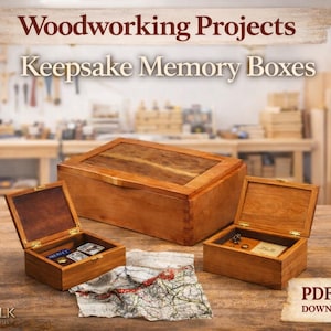 May include: A white ceramic mug with a black handle and the text "But First, Coffee" in a black, handwritten-style font. The mug is on a white surface.