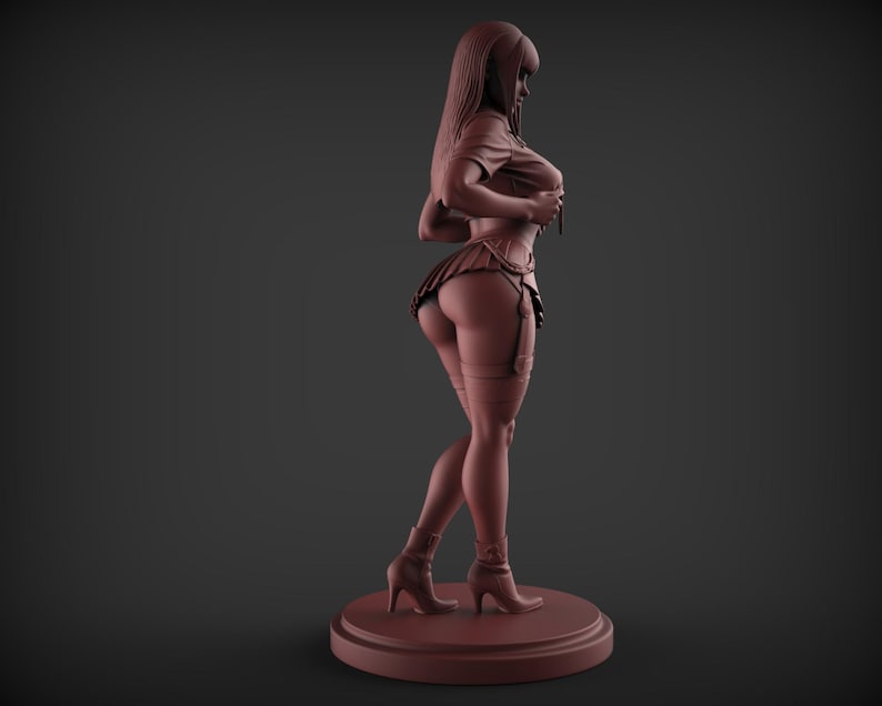 May include: A brown figurine of a person in a short skirt, top, and boots. The figure is standing on a round base. The figurine is a solid color and appears to be made of a hard material.