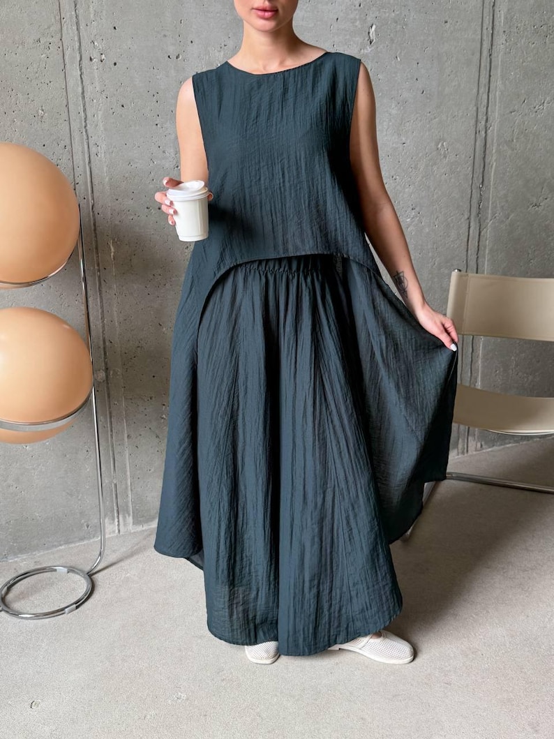 Women wearing ivory viscose tencel co-ord set with asymmetric tunic top and wide leg pants, minimalist summer outfit