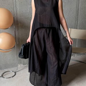 Women wearing ivory viscose tencel co-ord set with asymmetric tunic top and wide leg pants, minimalist summer outfit