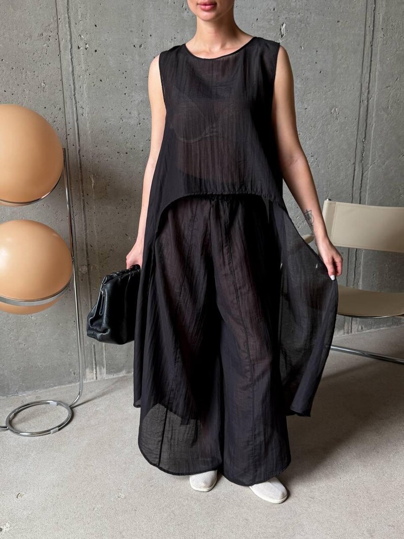 Women wearing ivory viscose tencel co-ord set with asymmetric tunic top and wide leg pants, minimalist summer outfit