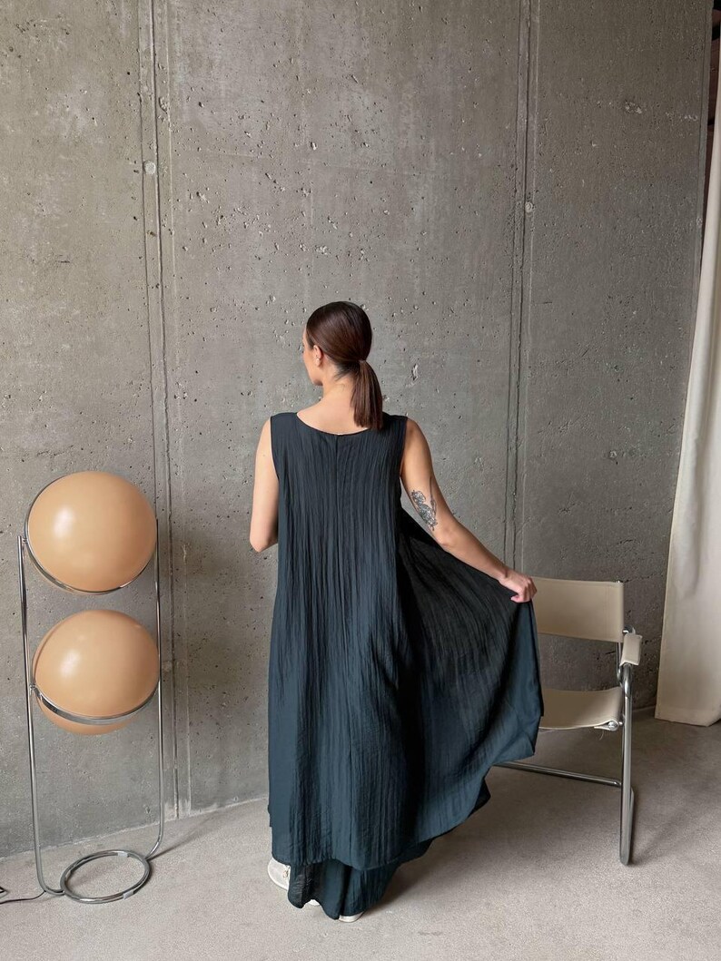 Back view of flowing asymmetric tunic and wide leg palazzo pants in ivory viscose tencel fabric, handmade ukrainian fashion