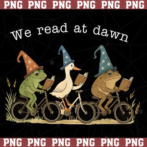 May include: A graphic illustration featuring two frogs and a goose wearing star-patterned wizard hats, each riding a bicycle while reading a book. The text "We read at dawn" is centered above the characters against a dark background.