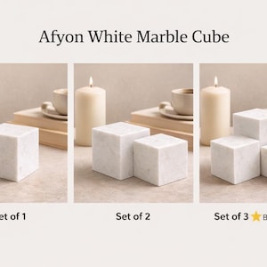 May include: A set of three ceramic mugs with a speckled, matte finish in cream, light grey, and dark grey. Each mug has a simple, minimalist design, suitable for coffee or tea.