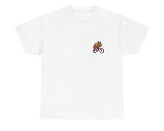 May include: White t-shirt featuring a small graphic of a possum riding a bicycle. The possum is brown and tan, and the bicycle is black. The t-shirt is made of a soft, comfortable material.