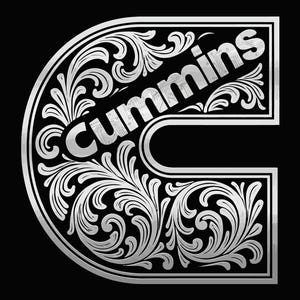May include: A large, silver-colored letter C featuring intricate, swirling filigree scrollwork patterns throughout its surface. The word Cummins is printed in a bold, silver, sans-serif font across the upper section of the letter against a black background.