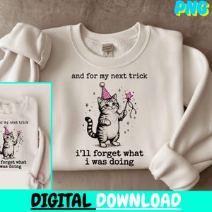 May include: White sweatshirt with a cartoon cat wearing a party hat and holding a star-tipped wand. Text on the sweatshirt says "and for my next trick, I'll forget what I was doing." The words "DIGITAL DOWNLOAD" are at the bottom.
