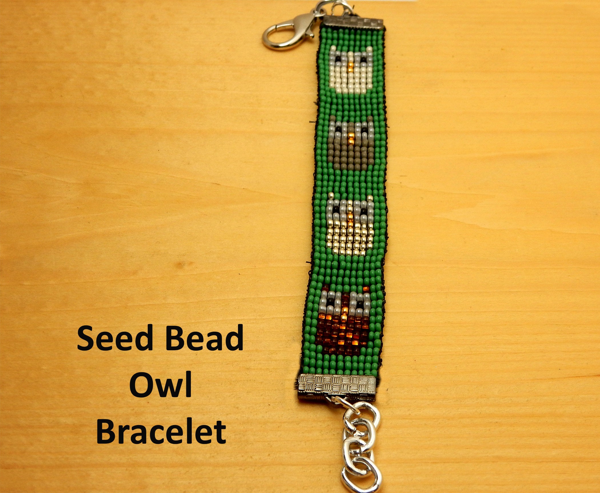 Owl Seed Bead Bracelet. Multi colored owls on a green background. Chain extension. Birthday or frien