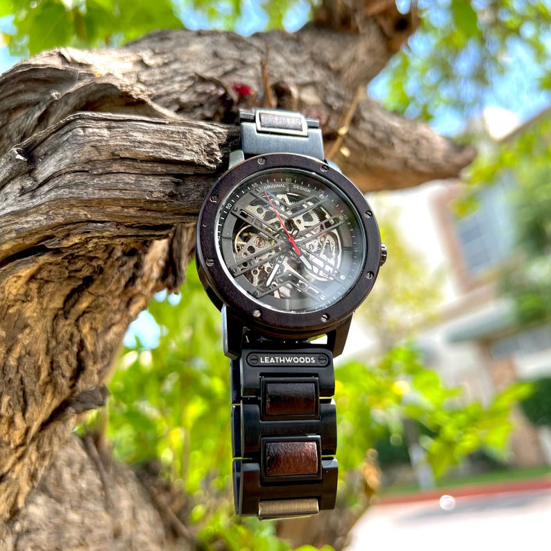 Angled view of mens wood watch Showing custom personalization message and red second hand