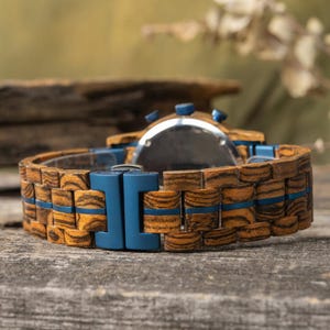 Wooden chronograph watch men zebrawood stainless steel strap detail
Wooden watch strap zebrawood stainless steel band close detail