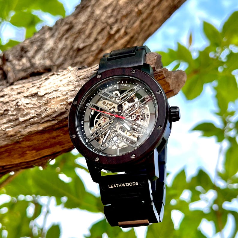 Close view of stainless steel clasp with wood inlay on mens wooden watch band
