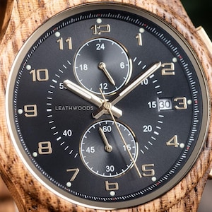 Close Dial view of handmade zebrawood wooden watch, stainless steel case and wooden strap men’s wrist watch