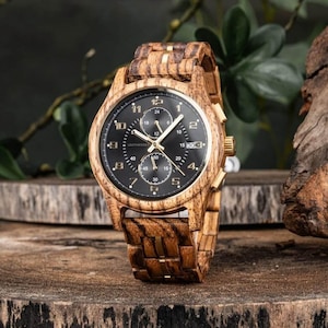 Front view of personalized wooden watch for men, handmade zebrawood wrist watch with brown and black dial and gold markers
