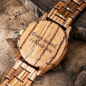Close up of custom engraving on back of wooden watch, personalized engraved men’s zebrawood wrist watch gift