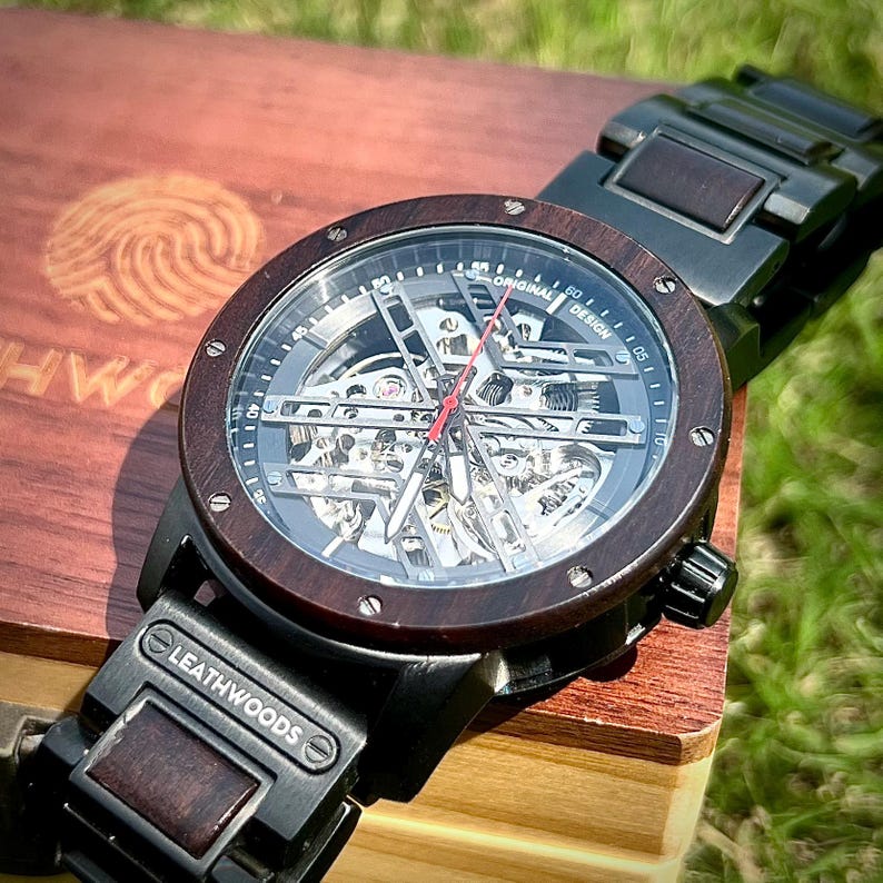 Front facing skeleton wooden watch for men with automatic mechanical movement and black dial detail