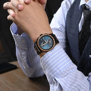 Men wearing Raven wooden watch on wrist, personalized wooden watch gift for groom, husband, or anniversary