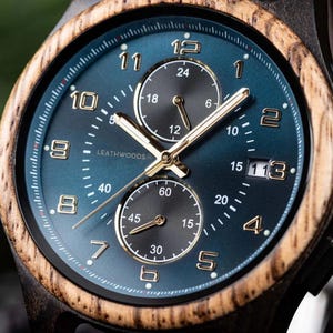 Close up of ebony and zebrawood men’s wooden watch, adjustable wooden band with natural inlay, eco friendly gift