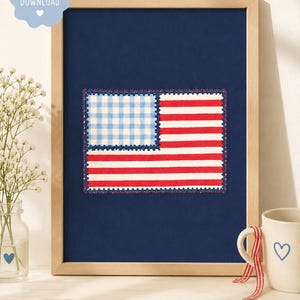 May include: A framed wall art print featuring a stylized American flag design on a dark blue background. The flag has a light blue and white gingham canton and horizontal red and white stripes, all bordered by a decorative dark blue stitched edge.