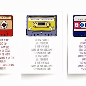 May include: Three illustrated cards featuring Depeche Mode cassette tapes. The tapes are red, yellow, and pink, each with song lyrics below. The cards are on a white background.