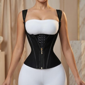 May include: Black corset with adjustable straps and a front zipper. The corset features a hook-and-eye closure and is designed to cinch the waist. The garment is made of a smooth, matte fabric and has a streamlined silhouette.